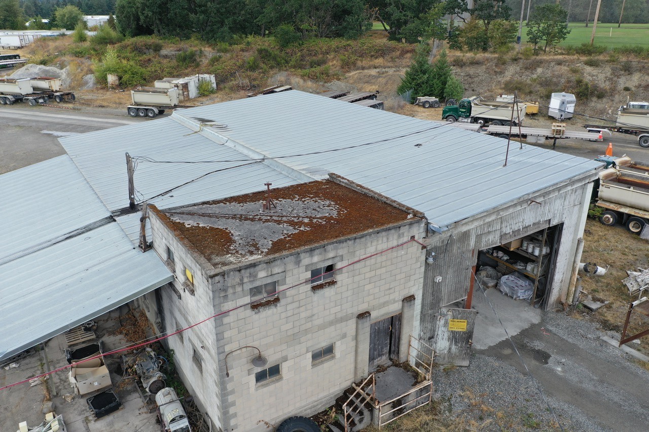 The Lakewood warehouse's raised roof section and adjoining metal panels.